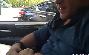 Fetish milf gives footjob in car