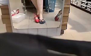 Spy on your sexy mom's sweaty feet while changing some different shoes in the store