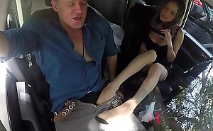 Footfetish babe tugging cock in the car